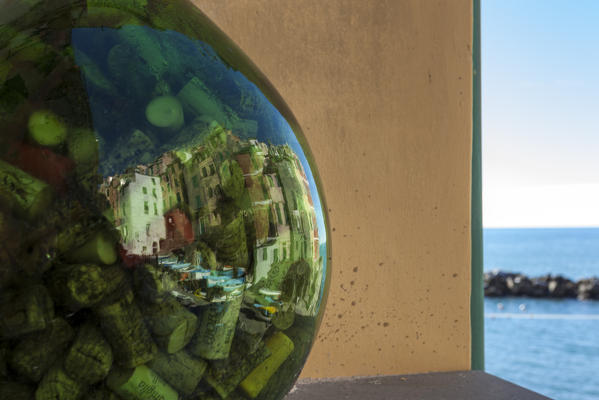 Reflection of the village of Riomaggiore. Cinque Terre, Riviera di Levante, Liguria, Italy