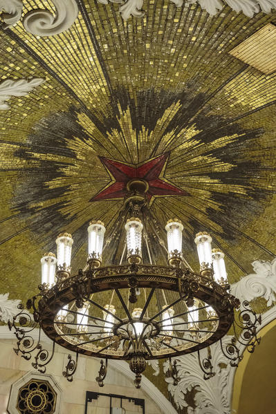 Russia, Moscow, Komsomolskaya Metro. Detail of a chandelier and ceiling.