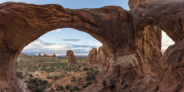 Landscape through Double Arch. Arches National Park, Moab, Grand County, Utah, USA.