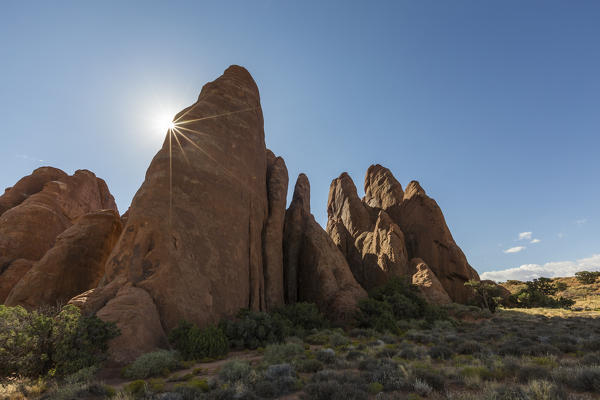 The sun shines in Arches National Park, Moab, Grand County, Utah, USA.