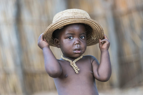 Mafwe child with hat. Mafwe Living Museum, Zambesi region, Namibia.