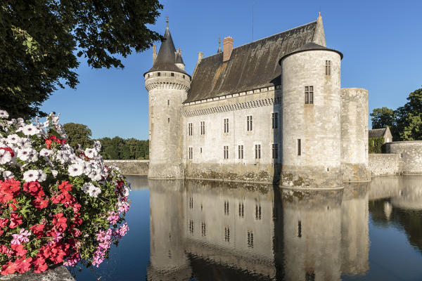 Medieval castle with flowers on the foreground. Sully-sur-Loire, Loiret, France.