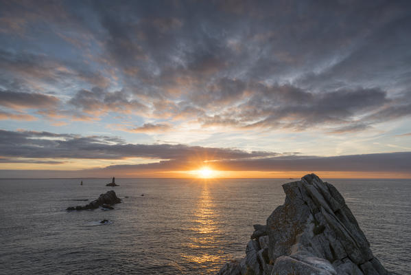 Vieille lighthouse from Raz point at sunset. Plogoff, Finistère, Brittany, France.