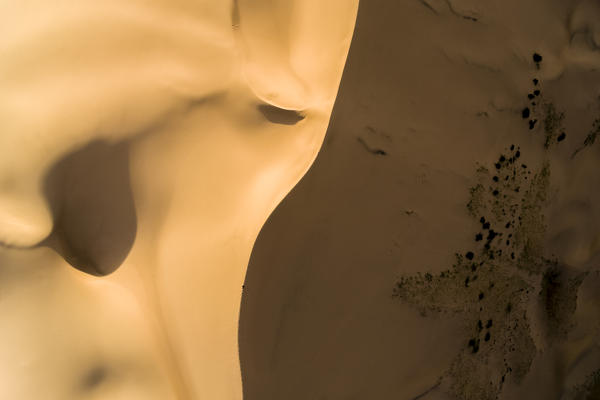 Aerial view of a person walking on the the edge of Khongor sand dunes in Gobi Gurvan Saikhan National Park. Sevrei district, South Gobi province, Mongolia.