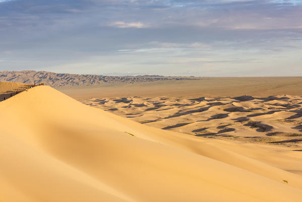 People on Khongor sand dunes in Gobi Gurvan Saikhan National Park. Sevrei district, South Gobi province, Mongolia.
