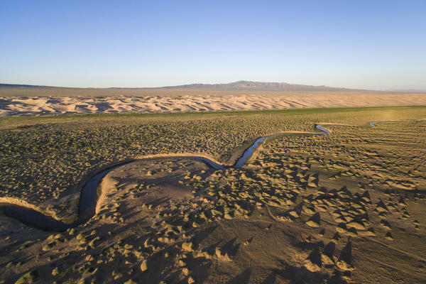 Aerial view of a Khongoriin river and Khongor dunes in Gobi Gurvan Saikhan National Park. Sevrei district, South Gobi province, Mongolia.