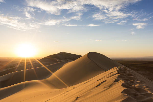 Golden light on Khongor sand dunes in Gobi Gurvan Saikhan National Park. Sevrei district, South Gobi province, Mongolia.