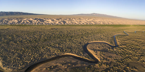 Aerial view of a Khongoriin river and Khongor dunes in Gobi Gurvan Saikhan National Park. Sevrei district, South Gobi province, Mongolia.