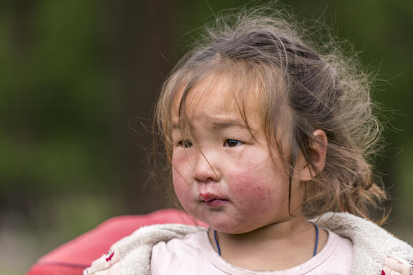 Portrait of a Mongolian nomadic little girl. Hovsgol province, Mongolia.