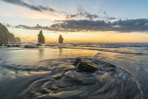 Sunset at the Three Sisters. Tongaporutu, New Plymouth district. Taranaki region, North Island, New Zealand.