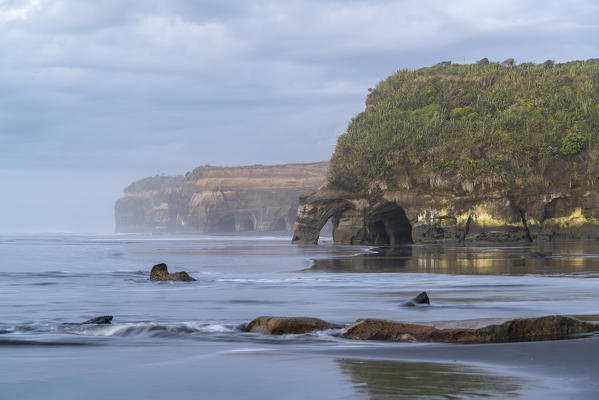 Rock formations at the Three Sisters. Tongaporutu, New Plymouth district. Taranaki region, North Island, New Zealand.