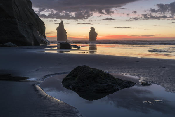 Sunset at the Three Sisters beach. Tongaporutu, New Plymouth district. Taranaki region, North Island, New Zealand.