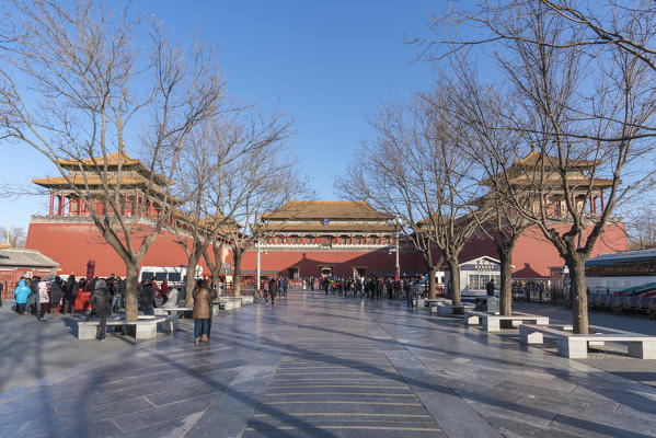 Tourists at the Meridian Gate, the main entrance to the Forbidden City. Beijing, People's Republic of China.