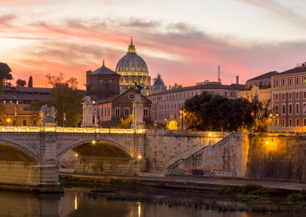 Rome at sunset with view of the dome of Saint Peter's Basilica, Octagonal Tower of the  church of the holy spirit in the saxon district and Tiber River
Europe, Italy, Lazio, Province of Rome, Rome, sunset