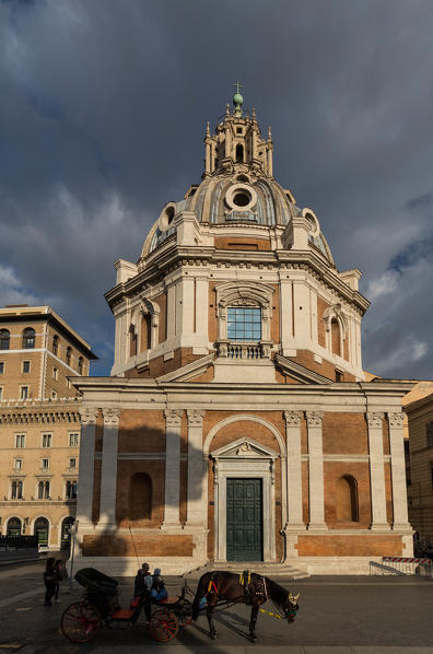 Italy, Lazio, Rome. Church of Saint Mary of Loreto and horse carriage.