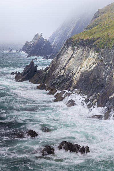 Foggy view of the Coumeenoole beach (Slea Head). Dingle peninsula, County Kerry, Munster province, Ireland, Europe.
