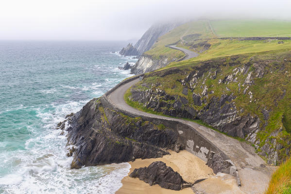 Foggy view of the Coumeenoole beach (Slea Head). Dingle peninsula, County Kerry, Munster province, Ireland, Europe.