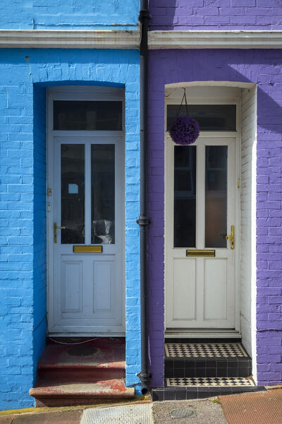 View of the doors of the colorful houses in Blaker street, Brighton, East Sussex, Southern England, United Kingdom.