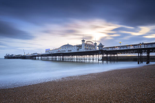 View of the Palace pier at sunset. Brighton, East Sussex, Southern England, United Kingdom.