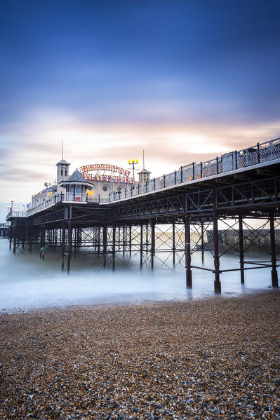 View of the Palace pier at sunset. Brighton, East Sussex, Southern England, United Kingdom.
