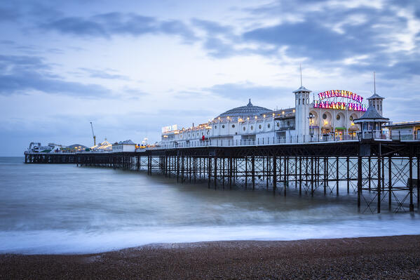 View of the Palace pier at sunset. Brighton, East Sussex, Southern England, United Kingdom.