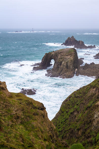 View of the Enys Dodnan Arch at Land's End. Penzance, Western Cornwall, England.