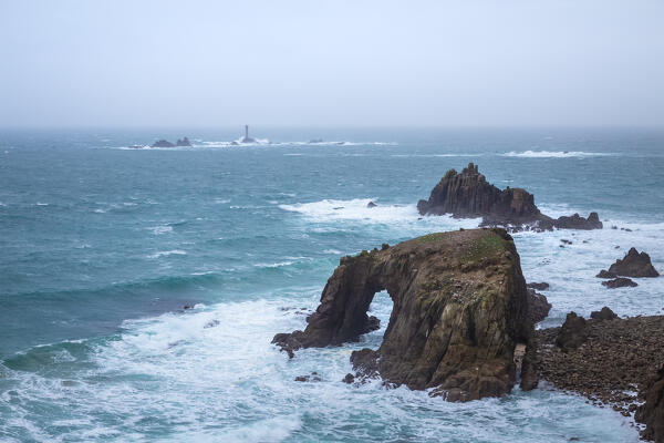 View of the Enys Dodnan Arch at Land's End. Penzance, Western Cornwall, England.
