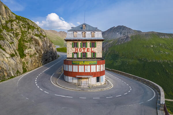 Aerial view of the Belvedere Hotel and the Furka Pass road, famous for a scene of the James Bond film Goldfinger, a high mountain pass in the Swiss Alps connecting Gletsch, Valais with Realp, Uri. Obergoms, Canton of Valais, Swiss Alps, Switzerland.
