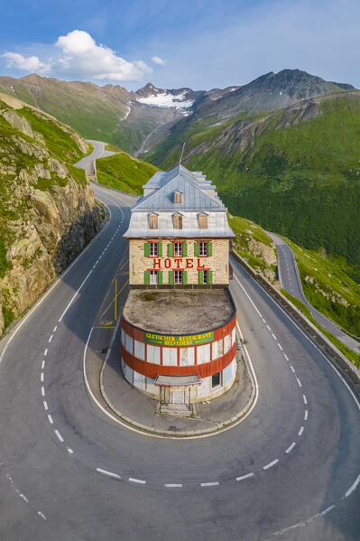 Aerial view of the Belvedere Hotel and the Furka Pass road, famous for a scene of the James Bond film Goldfinger, a high mountain pass in the Swiss Alps connecting Gletsch, Valais with Realp, Uri. Obergoms, Canton of Valais, Swiss Alps, Switzerland.