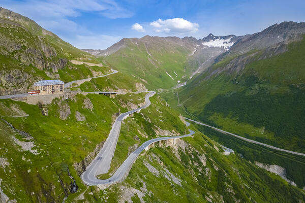 Aerial view of the Belvedere Hotel and the Furka Pass road, famous for a scene of the James Bond film Goldfinger, a high mountain pass in the Swiss Alps connecting Gletsch, Valais with Realp, Uri. Obergoms, Canton of Valais, Swiss Alps, Switzerland.