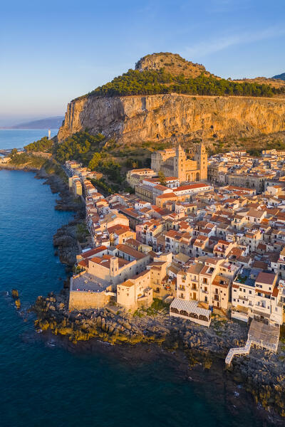 Aerial view of the ancient town of Cefalù, Unesco World Heritage site, at sunset. Palermo district, Sicily, Italy.