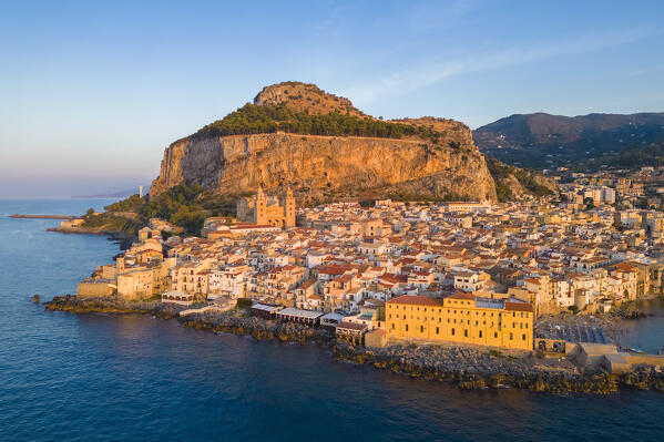 Aerial view of the ancient town of Cefalù, Unesco World Heritage site, at sunset. Palermo district, Sicily, Italy.