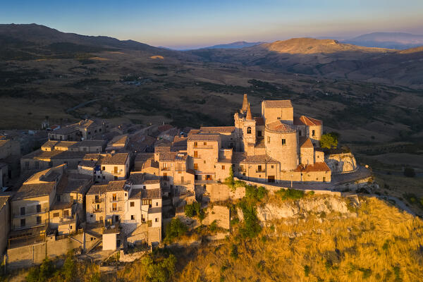 Aerial view of the ancient town of Petralia Soprana, built on a cliff, at sunset. Palermo district, Sicily, Italy.