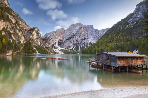 View of Braies lake in autumn season at sunset. Europe, Italy, South Tyrol, Braies valley, Bolzano province, Braies municipality.