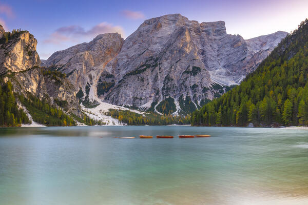 View of Braies lake in autumn season at sunset. Europe, Italy, South Tyrol, Braies valley, Bolzano province, Braies municipality.