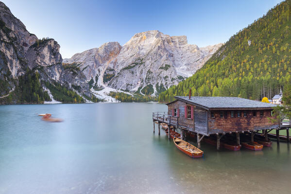 View of Braies lake in autumn season at sunrise. Europe, Italy, South Tyrol, Braies valley, Bolzano province, Braies municipality.