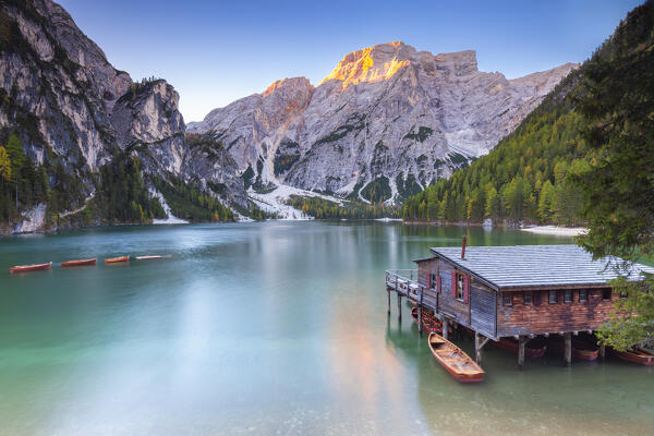 View of Braies lake in autumn season at sunrise. Europe, Italy, South Tyrol, Braies valley, Bolzano province, Braies municipality.
