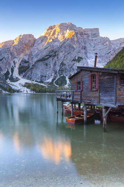 View of Braies lake in autumn season at sunrise. Europe, Italy, South Tyrol, Braies valley, Bolzano province, Braies municipality.