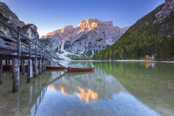 View of Braies lake in autumn season at sunrise. Europe, Italy, South Tyrol, Braies valley, Bolzano province, Braies municipality.