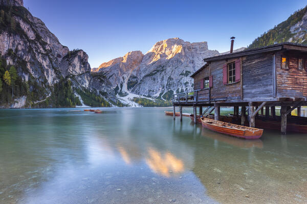 View of Braies lake in autumn season at sunrise. Europe, Italy, South Tyrol, Braies valley, Bolzano province, Braies municipality.