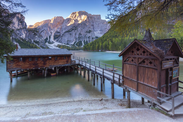 View of Braies lake in autumn season at sunrise. Europe, Italy, South Tyrol, Braies valley, Bolzano province, Braies municipality.