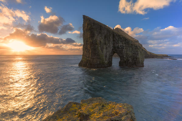 Sunset over the ocean and rock formation of Drangarnir, Vagar Island, Faroe Islands, Denmark