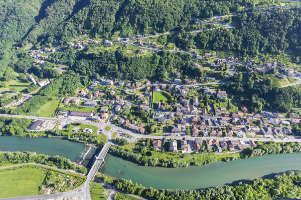 Hang gliding over the village of Mantello, lower Valtellina, Sondrio province, Lombardy, Italy