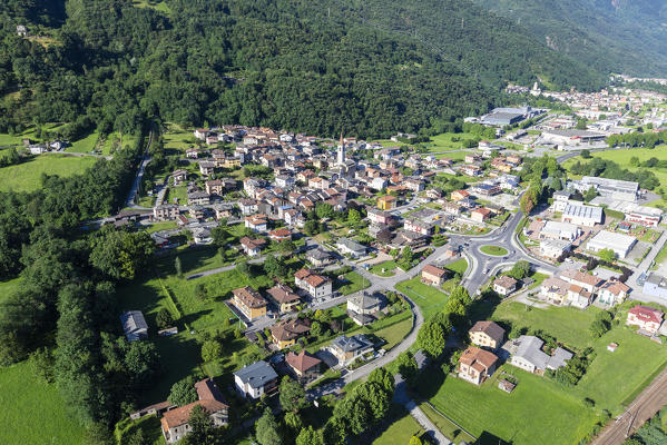 Hang gliding over the village of Rogolo, lower Valtellina, Sondrio province, Lombardy, Italy