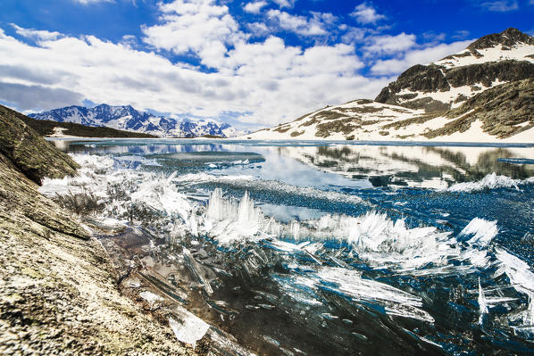 Ice crystals on surface of Lej da la Tscheppa during spring thaw, St. Moritz, Engadin, canton of Graubunden, Switzerland