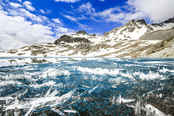 Ice crystals on surface of Lej da la Tscheppa during spring thaw, St. Moritz, Engadin, canton of Graubunden, Switzerland