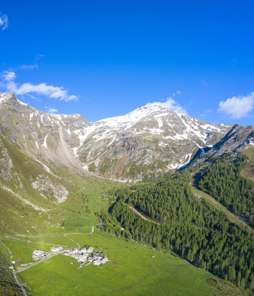 Monte Groppera and huts in green pastures, aerial view, Madesimo, Valchiavenna, Sondrio province, Valtellina, Lombardy, Italy