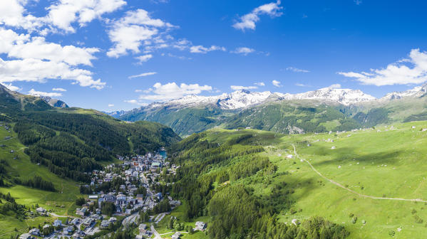 Aerial panoramic of Madesimo and Andossi in spring, Valchiavenna, Valle Spluga, Valtellina, Lombardy, Italy