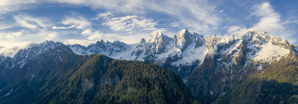 Panoramic of Sciore, Pizzo Badile and Cengalo surrounded by woods, Bondasca valley, Bregaglia Valley, Graubunden, Switzerland