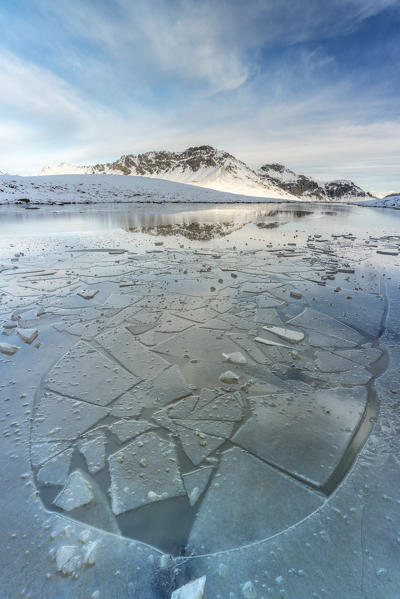 Ice sheets on frozen lake at feet of Piz Umbrail, Braulio Valley, Stelvio Pass, Bormio, Sondrio province, Valtellina, Lombardy, Italy